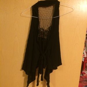 Flare vest with lace back. Ties up in back